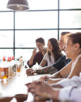 Group of visitors tasting CIRKA spirits at the distillery bar